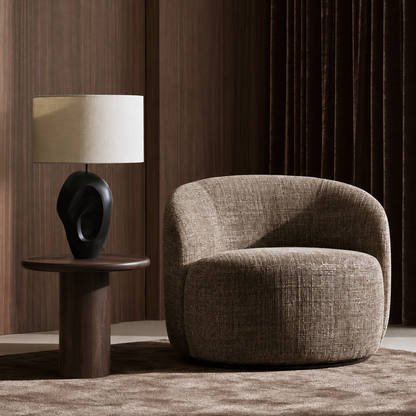 Mirea Lounge Chair in a luxury contemporary living room with warm wood paneling and designer lighting by Dezaro